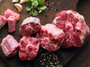 Rumba Meats Beef Oxtail Raw on Cutting Board