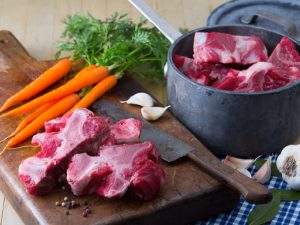 Rumba Meats Beef Neck Bones Raw on Cutting Board