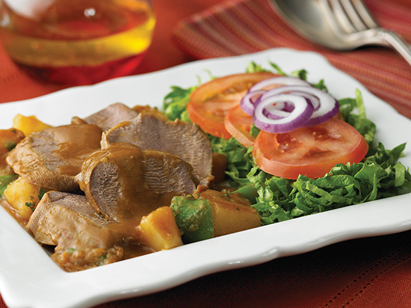 Sliced Beef Tongue Stew with Potatoes & Veggies Recipe Plated
