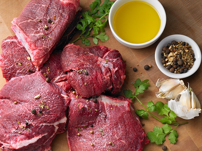 Rumba Meats Beef Cheakmeat Raw on Cutting Board