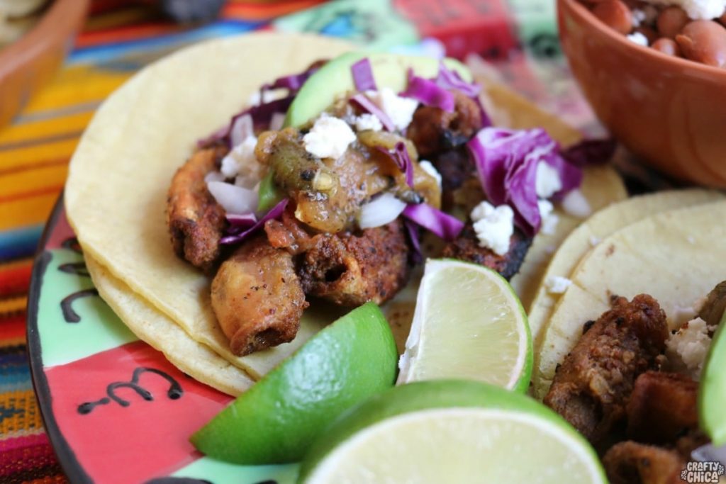Grilled Tripas Tacos on Table with fresh Ingredients close up picture