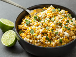 Street Corn (Esquites) in a Bowl with fresh lime